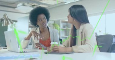 Animation of financial data processing over diverse businesswomen in office. Global business, finance, computing and data processing concept digitally generated video.