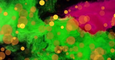 Yeşil ve pembe lekeler üzerinde turuncu ışık kürelerinin animasyonu. Şekil, renk ve ışık konsepti dijital olarak oluşturulmuş video.