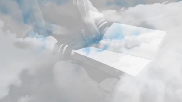 云彩笼罩着拿着书的人 信仰和宗教概念数码视频 — 图库视频影像