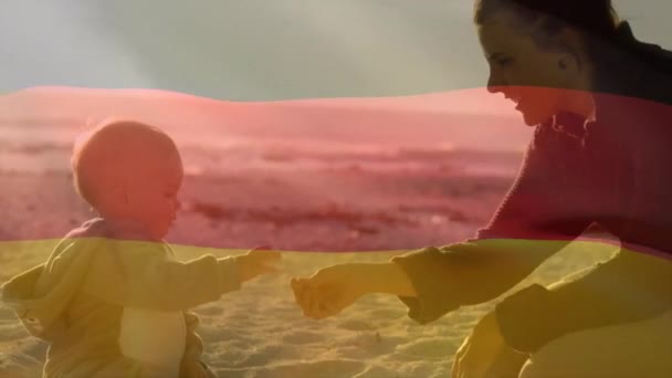 Animazione Bandiera Tedesca Madre Caucasica Bambino Che Gioca Sulla Spiaggia — Video Stock