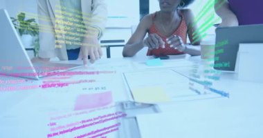 Animation of financial data processing over diverse businesswomen in office. Global business, finance, computing and data processing concept digitally generated video.