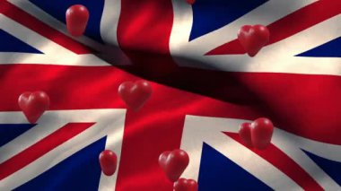 İngiliz bayrağı üzerinde hareket eden kırmızı kalplerin animasyonu. Sevgililer Günü, aşk ve kutlama konsepti dijital olarak oluşturulmuş video.