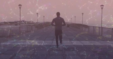 Gezinti güvertesinde koşan Afro-Amerikan bir adamın hareketli görüntüsü. sağlık ve zindelik kavramı dijital olarak oluşturulmuş görüntü.