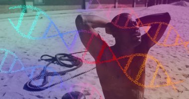 Yorgun, Afro-Amerikan formda bir adamın plajda mola vermesine karşı çok renkli DNA yapıları. spor ve spor konsepti