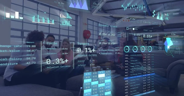 Image of financial data processing over diverse business people in office. Global networks, business, finances, computing and data processing concept digitally generated image.