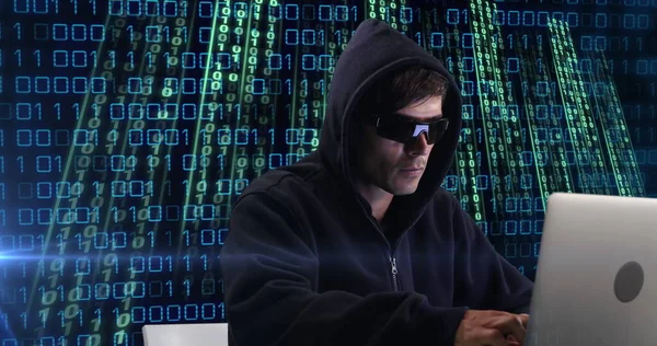 Image of caucasian hacker over data processing on dark background. Global connections, data processing and digital interface concept digitally generated image.