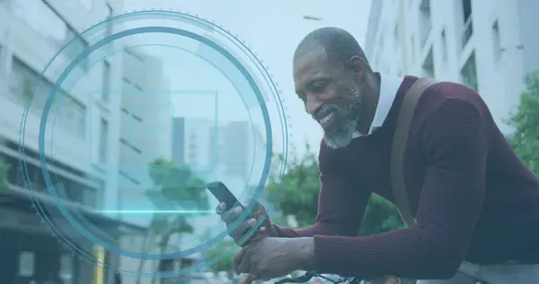 African American businessman checks phone outdoors, with copy space. He\'s engaging with modern technology while commuting in an urban setting.