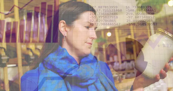 Image of statistics data processing over caucasian female customer in food shop. Business, retail, communication, digital interface, finance and data processing concept digitally generated image.