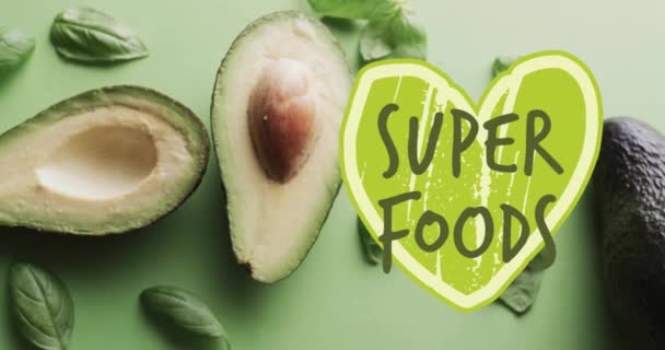 Animatie Van Superfoods Tekst Groen Hart Avocado Groene Achtergrond Fruit — Stockvideo