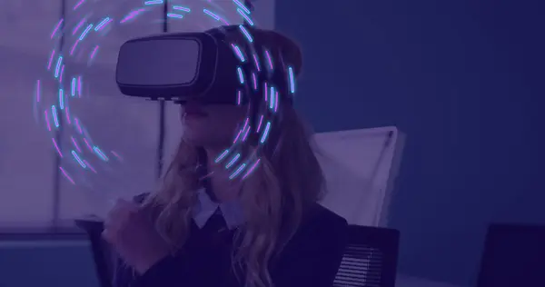 Image of glowing light trails of data transfer over caucasian woman in vr headset. Global virtual reality, data processing, computing and digital interface concept digitally generated image.
