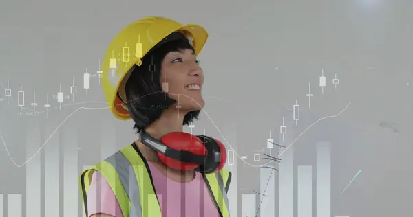 Asian female construction worker and foreground graphs.