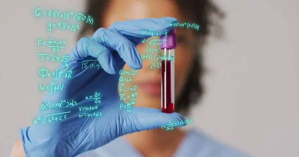Image of mathematical equations over biracial female doctor with test tube. Global medicine and digital interface concept digitally generated image.