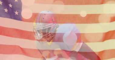 Afro-Amerikan Amerikan futbolcusu ve Amerikan bayrağının animasyonu. Amerikan vatanseverliği, spor ve rekabet konsepti dijital olarak oluşturulmuş video.