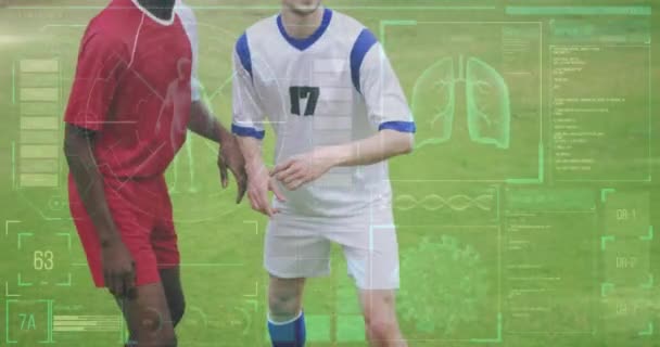 Animation Von Diagrammen Und Wissenschaftlicher Datenverarbeitung Über Verschiedene Männliche Fußballer — Stockvideo