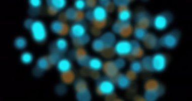 Siyah arkaplanda sönmüş turuncu ve mavi ışık lekeleri. İşlem, veri, enerji, ışık, bağlantı, teknoloji ve iletişim, dijital olarak oluşturulmuş video.