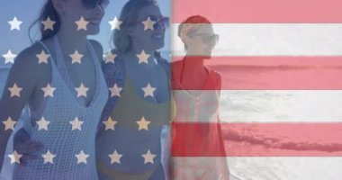 Amerika bayrağının animasyonu, yaz aylarında sahildeki çeşitli kadın arkadaşlara karşı. Amerikan vatanseverliği, çeşitlilik ve tatil konsepti dijital olarak oluşturulmuş video.