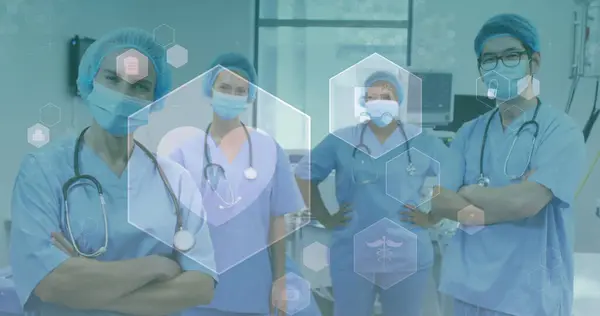 Image of medical icons over diverse doctors wearing face masks. global medicine, healthcare and technology during covid 19 pandemic concept digitally generated image.