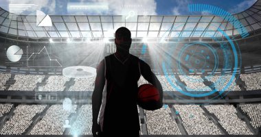 Spor stadyumuna karşı basketbol oynayan erkek basketbolcunun siluetinin üzerine konfeti düştü. Spor yarışması ve turnuva konsepti