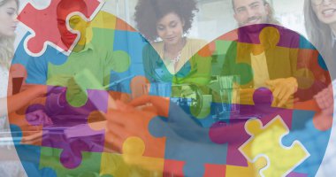 Renkli yapboz parçaları, elektronik aletlerle iş arkadaşlarının kalbinin üzerinde. otizm, öğrenme güçlüğü, destek ve farkındalık kavramı dijital olarak oluşturulmuş görüntü.