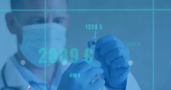 Image of data processing over caucasian male doctor with face mask and syringe. Global medicine, vaccination, healthcare and data processing concept digitally generated image.
