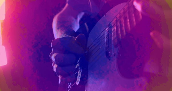Image of green and pink shapes moving over hand of guitarist playing electric guitar. Live music, creativity, performance and entertainment concept digitally generated image.