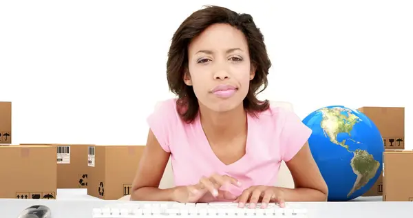 Image Woman Typing Computer Keyboards Globe Stacks Boxes White Background — Stock Photo, Image