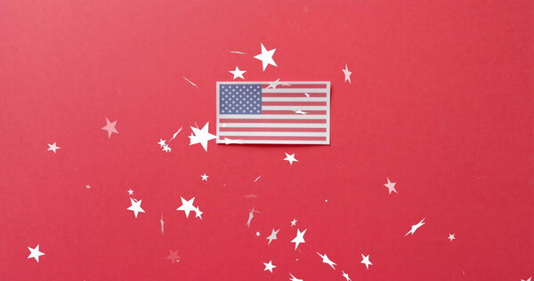 Image of stars falling over flag of united states of america on red background. American independence, tradition and celebration concept digitally generated image.