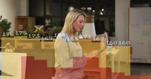 Image of financial data processing over caucasian businesswoman working in office. Global business, finances, computing and data processing concept digitally generated image.