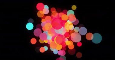 Siyah arkaplanda renkli noktaların canlandırması. Şekiller, renkler, hareket ve arkaplan konsepti dijital olarak oluşturulmuş video.