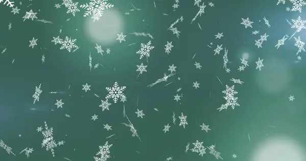 緑色の背景に光の点から落ちる雪片のデジタル画像 クリスマスのお祭りやお祝いのコンセプト — ストック写真