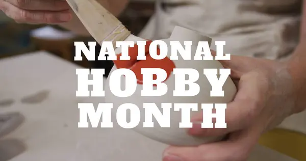 Image of national hobby month text over midsection of caucasian woman painting pottery. hobby and lifestyle concept digitally generated image.