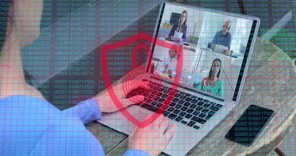 Laptop screen displays a virtual meeting with four participants. Overlay of digital security elements suggests a focus on cybersecurity in remote work environments.