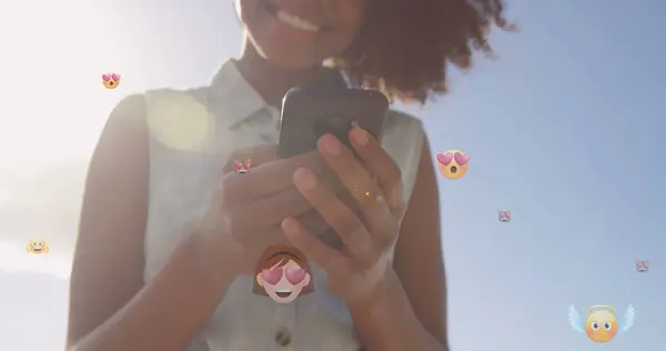 Image Emoticons Midsection Biracial Woman Using Smartphone Outdoors Global Connections — Stock Photo, Image