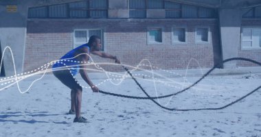 Afrika kökenli Amerikalı bir adamın üzerinde hareket eden çizgiler. Küresel bağlantılar, refah, zindelik ve sağlıklı yaşam tarzı konsepti dijital olarak oluşturuldu.