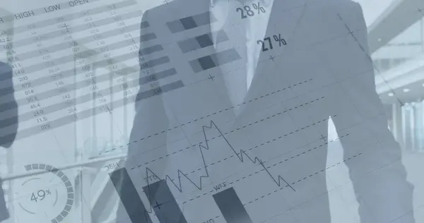 Image of financial data and graphs over caucasian businessman walking in office. business, finance, economy and technology concept digitally generated image.