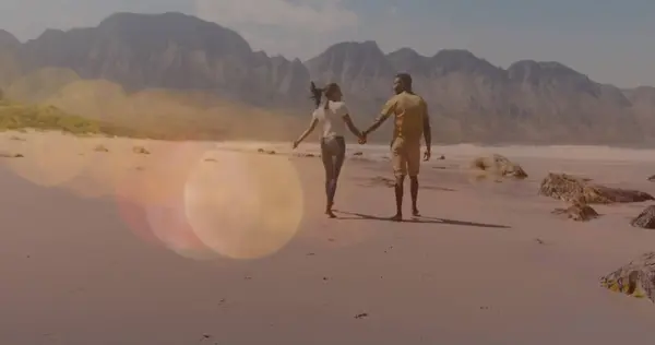 Multiple Light Spots Floating African American Couple Holding Hands Walking — kuvapankkivalokuva