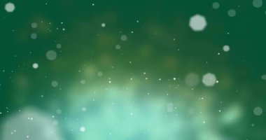 Yeşil arkaplanda hareket eden parlak ışık lekelerinin canlandırması. Renk, şekil, ışık ve hareket konsepti dijital olarak oluşturulmuş video.
