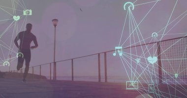 Sahilde koşan Afro-Amerikan bir adam üzerinde birbirine bağlı ikonların küre oluşturduğu görüntüler. Dijital bileşik, çoklu pozlama, iletişim, küreselleşme, sağlık ve zindelik kavramı.