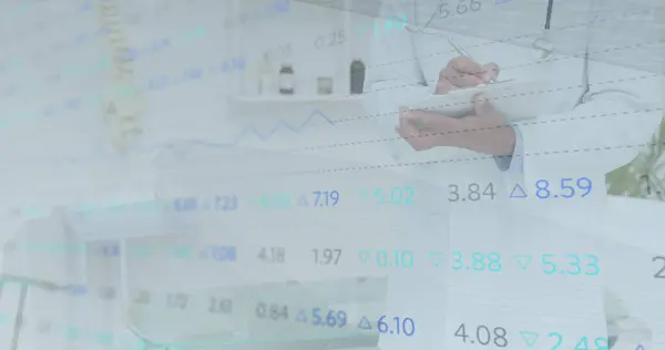 stock image Image of statistics and data processing over smiling caucasian male doctor making notes. medicine and healthcare services concept digitally generated image.