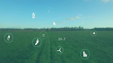 Rüzgar türbinleri ve enerji ikonları yeşil alan manzarası üzerinde animasyon. Yenilenebilir, rüzgar gücü, sürdürülebilirlik, çevre dostu, temiz enerji, çevre