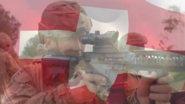 Çeşitli askerlerin ateş etmesi üzerine Swizterland bayrağı animasyonu. Silahlı kuvvetler, savaş, çatışma, vatanseverlik ve savunma konsepti dijital olarak oluşturulmuş video.