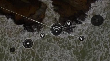 Ağ bağlantısı simgeleri ve çizgileri kayalık kıyı şeridinin hava görüntüsü üzerinde. Teknoloji, iletişim, dijital, dron, veri, fütüristik