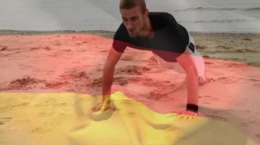 Alman bayrağı animasyonunda plajda şınav çeken adam. Fitness, egzersiz, egzersiz, güç, açık hava, motivasyon