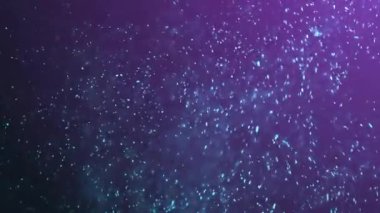 Mor arkaplanda hareket eden parlak ışık lekelerinin canlandırması. Renk, şekil, ışık ve hareket konsepti dijital olarak oluşturulmuş video.