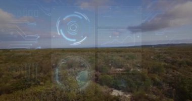 Veri haritaları ve hava manzarası üzerindeki grafiklerle dijital arayüz canlandırılıyor. Teknoloji, veri görselleştirme, analitik, yenilik, etkileşimli