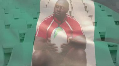Nijerya bayrağının Afro-Amerikan rugby oyuncusu üzerinde oynanması. Küresel spor, rekabet, bağlantılar, hesaplama ve veri işleme kavramı, dijital olarak oluşturulmuş video.