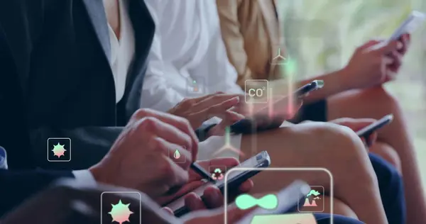 stock image Image of ecology icons over diverse colleagues using smartphones in office. Business, technology and digital interface concept digitally generated image.