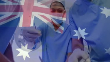 Cerrahlar ameliyat sırasında Avustralya bayrağının animasyonu. Tıp, vatanseverlik ve dijital arayüz kavramı, dijital olarak üretilen video.
