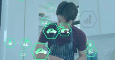 Mutfakta yemek hazırlayan, sürdürülebilirlik ve çevresel etki ikonlarının canlandırmasıyla çevrili bir adam. Yemek pişirme, çevre dostu, hazırlık, sağlıklı, yeşil, yaşam tarzı