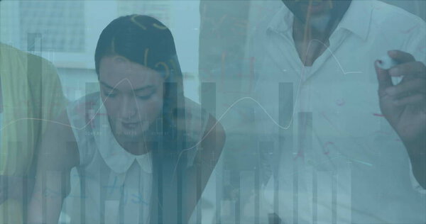 Image of financial data processing over diverse business people in office. Global business, finance, computing and data processing concept digitally generated image.